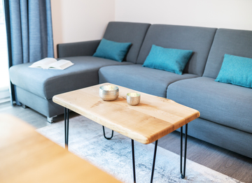 The couch in the living room will welcome you to have a relaxed day or evening